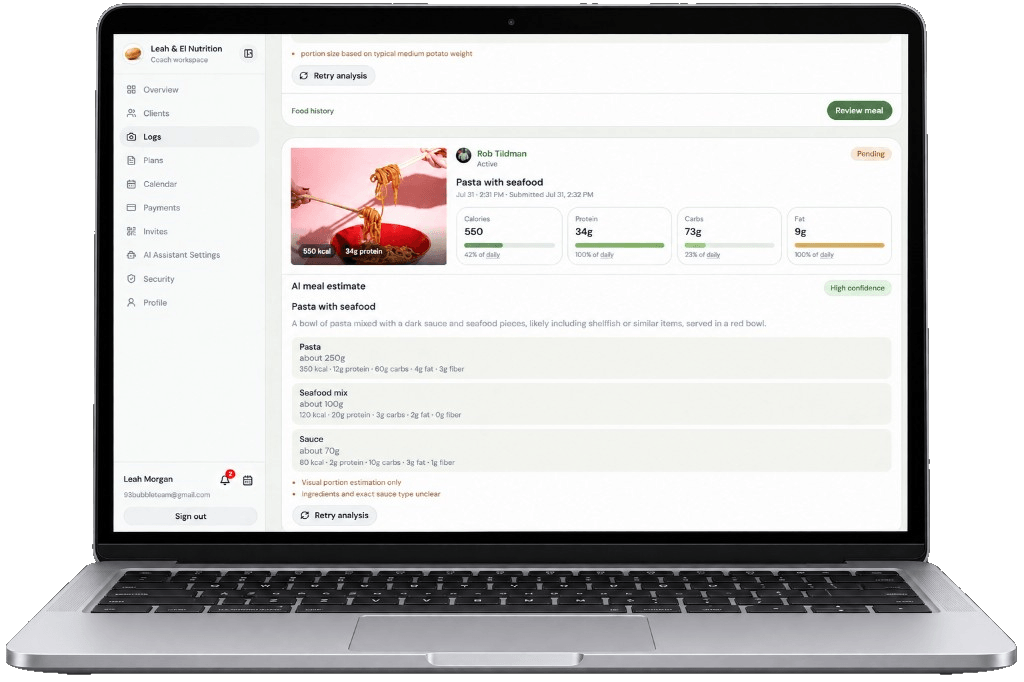 BiteSmart coach workspace showing client food logs on a laptop